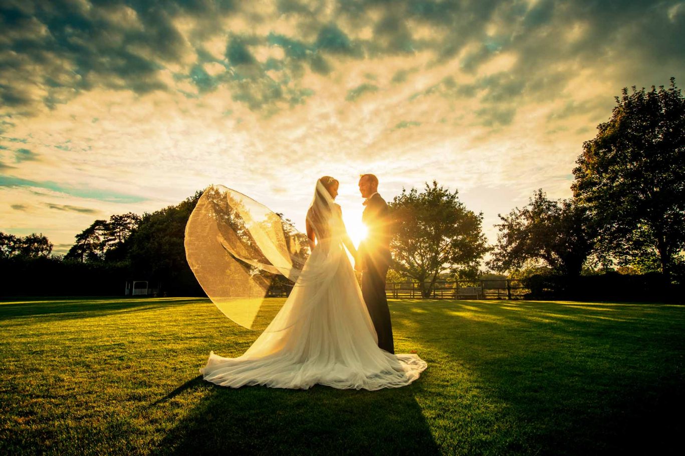 Wedding couple outdoor setting sun in essex